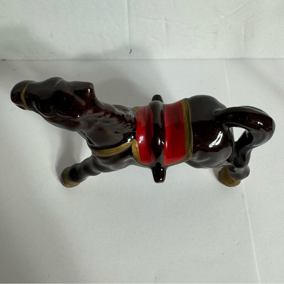 Vintage small brown ceramic horse figurine featuring gold trim and a red saddle. - Picture 2 of 10